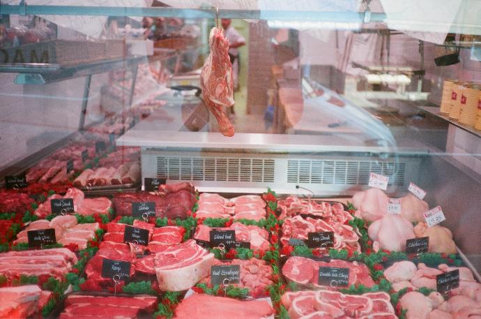 raw meat in clear plastic container